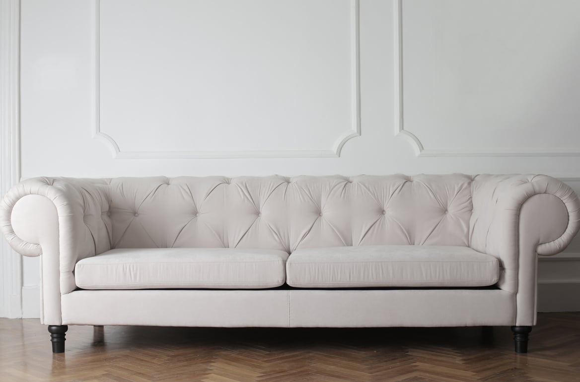 Photo Of White Couch On Wooden Floor